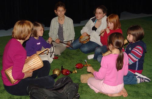 martha with 6 children in workshop